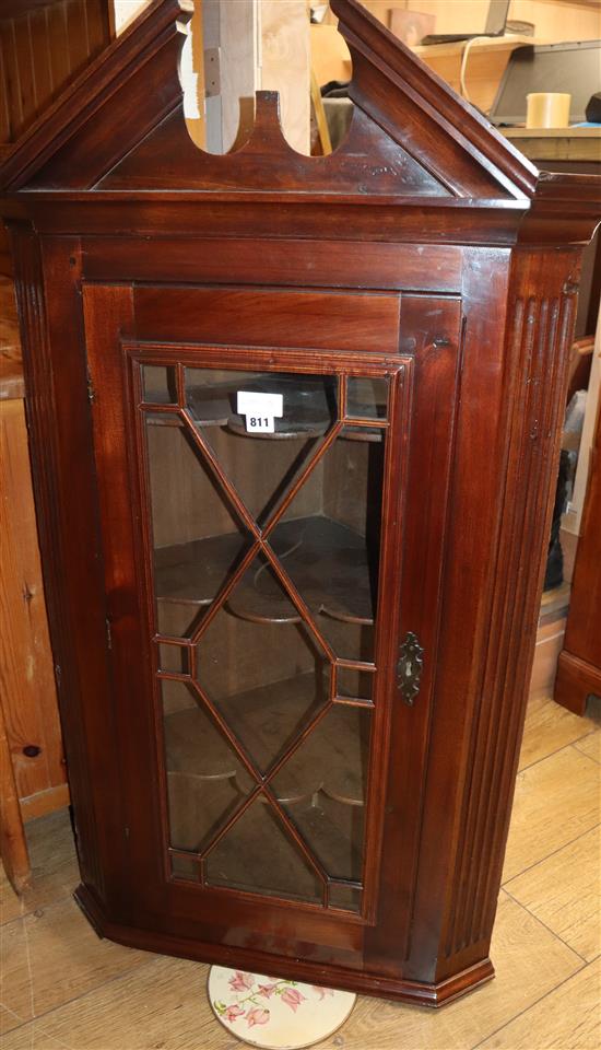 A George III mahogany hanging corner cabinet W.74cm